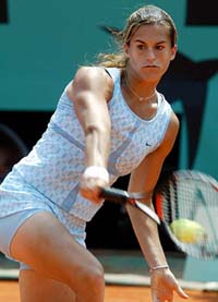 Amelie Mauresmo of France hits a backhand to Magui Serna of Spain in the fourth round of the French Open at Roland Garros Stadium in Paris on sunday. 