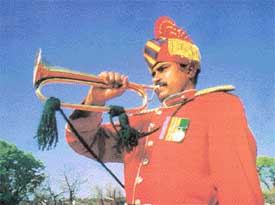 An Army bugler in ceremonial dress
