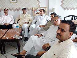 Rashtriya Lok Dal MLAs from Uttar Pradesh relax in a hotel room in Bhopal on Monday.