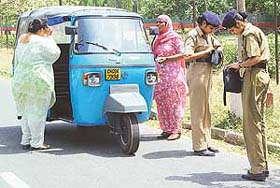 Policewomen check bags of women near the Punjab Chief Ministers official residence in Chandigarh