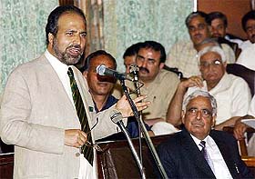Finance Minister Muzaffar Hussain Beigh presents the budget in the state Assembly