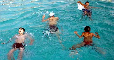 Children enjoy a swimming session as mercury sores in Ambala