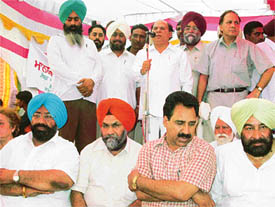 Ch Jagjit Singh, Local Bodies Minister, addresses a function at Daba in Ludhiana on Wednesday. Mr M.S. Dakha, MLA