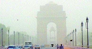 The India Gate was barely visible in the haze on Thursday