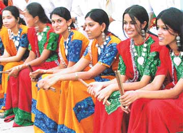 Girls from Punjab Engineering College, Sector 12, wait to perform dandiya during the closing function of the National Sub-junior Netball Championship