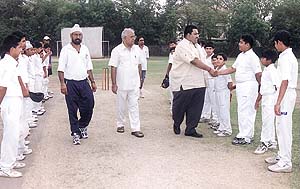Municipal Councillor Rohit Manchanda, accompanied by Gyan Bharati School Principal R. C. Shekhar and former India player Gursharan Singh meeting the players before the opening match