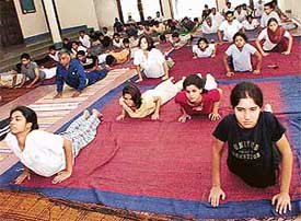 Students of Punjab Engineering College participate in a yoga camp on the campus in Chandigarh on Tuesday.
