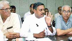 Former MP Satya Pal Jain (centre) addresses a press conference in Chandigarh on Wednesday. 