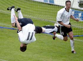 Germanys Miroslav Klose jumps a summersault