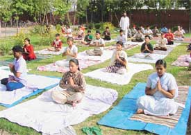Students of Everest Public School perform yoga during a summer camp organised