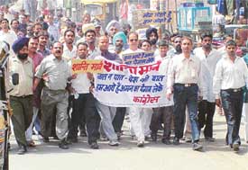 Congress activists take out a peace march in Ludhiana on Friday