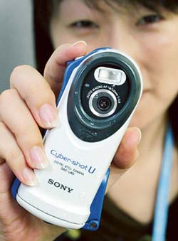 A Sony Corp employee shows of the new waterproof two mega-pixel digital camera Cyber-shot U DSC-U60 in Tokyo.