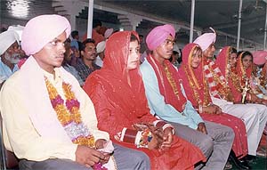 A mass marriage ceremony of 111 couples was held at the Raj Kamal palace in Patiala 