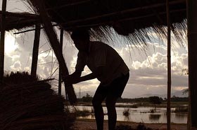 A flood victim repairs his house