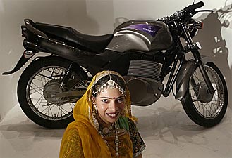 Decked in traditional finery, an Indian girl poses before the Genxt