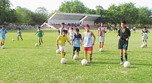 School boys during a practice session at the Sector 17 Football Stadium in Chandigarh.