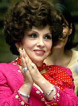 Italian actress Gina Lollobrigida reacts during a news conference