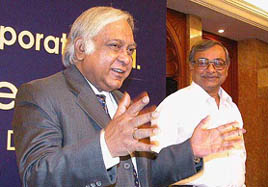 Chairman and MD of ONGC Subir Raha presents the annual report of ONGC to the media