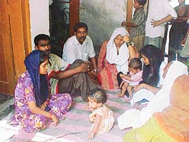 Members of Jagdish Bahadurs family mourn his death at Aman Nagar