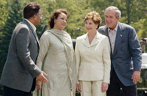 US President George W. Bush and his wife Laura Bush share a light moment with Pakistan President Pervez Musharraf and his wife Sehba at the end of a joint Press conference at Camp David in Maryland on Tuesday. 