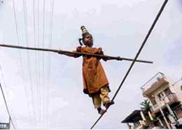 Rajni, a six-year-old Gujarati girl, performs tight-rope walking