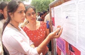 Candidates scanning the first cut-off list of Delhi University 
