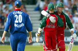 Zimbabwe's Grant Flower and Sean Ervine celebrate their victory over England
