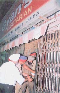 MC officials seal a restaurant, Gyans Vegetarian, near the Clock Tower for violating fire-safety norms