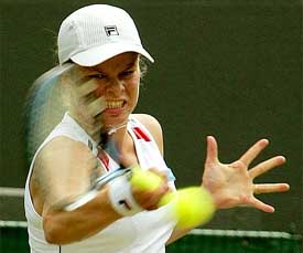 Belgium's Kim Clijsters returns to Samantha Reeves of the US