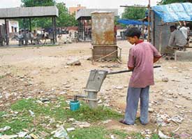 Like this labourer, who is storing contaminated water, many residents of Colony No. 5 are running a health hazard by consuming water from this hand pump