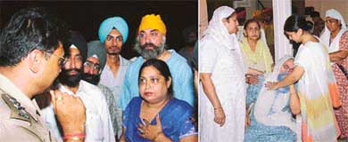 A police officer questions a neighbour of Amarjit Kaur