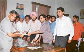 Representatives of different student unions present a memorandum of their demands to Mr V.P. Gaur, Principal