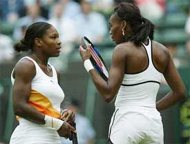 Serena Williams speaks with her sister Venus