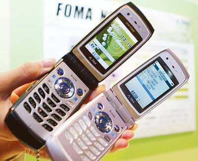 New handsets manufactured by NEC Corp are displayed at an unveiling in Tokyo