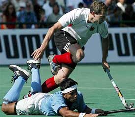 Christoph Bechmann of Germany jumps over Indias Jugraj Singh