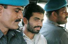 Militant Rizwan Ahmed Basheer is escorted to a court in Karachi