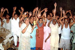 Residents of certain localities of Bathinda protest against long and unscheduled power cuts, on Tuesday night.