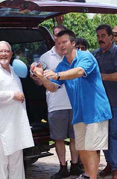 Australian Test team skipper Steve Waugh throws a rugby ball 