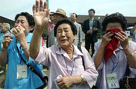 South Koreans cry as they bid farewell to their North Korean relatives at a resort in North Korea's Kumgang mountains