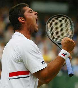 Australia's Mark Philippoussis celebrates his victory over Alexander Popp of Germany