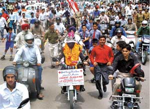 Magician Samrat Shankar drives blindfolded on a motor cycle