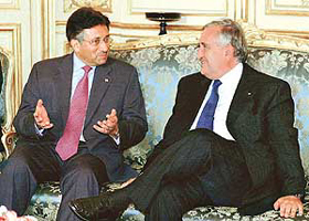 Pakistan President Pervez Musharraf talks with French Prime Minister Jean-Pierre Raffarin prior to their meeting in Paris on Thursday. Musharraf is on a three-day official visit to France to discuss security in central and southern Asia as well as bilateral relationships.