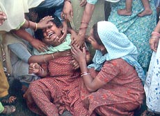 The widow of Mohan Lal, who was picked up by the Jammu police, wails after the arrival of his body in Amritsar on Friday.