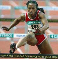 Gail Devers of the US takes a hurdle on the way to win the women's 100-metre hurdles race