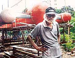 Debi Mitra plans to go sail around the world in the special boat seen in the background