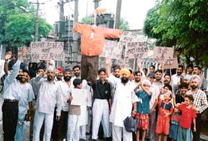 Members of the Peoples Welfare Council raise slogans in protest against vulgarity and obscenity in music videos in Ludhiana on Sunday.