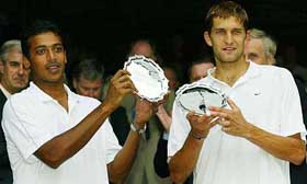 India's Mahesh Bhupathi and his partner Max Mirnyi from Belarus display their runner-up trophies 
