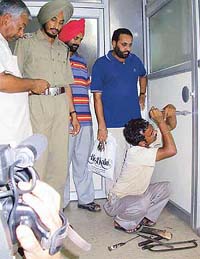 A blacksmith tries to open the door of a cabin in Sector 35, Chandigarh
