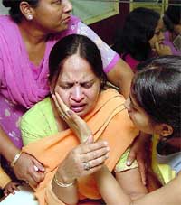 Seema Gupta, wife of R.K. Gupta, along with relatives of Wimpys International employees