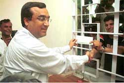 Delhi Transport Minister Ajay Makan handing over the first ticket to a passenger going to Pakistan on July 11